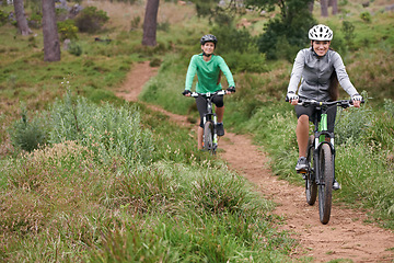 Image showing Happy woman, portrait and friends with bicycle for cycling, off road travel or trail in nature. Female person, rider or biker with smile in forest for fitness, workout or outdoor sports exercise