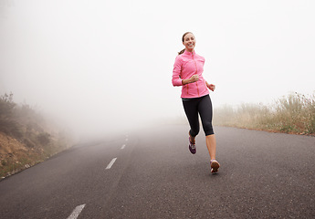 Image showing Nature, sports and portrait of woman running on mountain road for race, marathon or competition training. Fitness, exercise and female athlete with cardio workout in misty outdoor woods or forest.