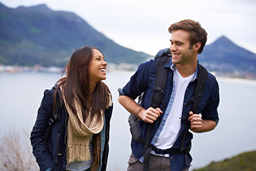 Image showing Hiking, nature and couple on mountain laugh with backpack for love, trekking and explore landscape. Travel, dating and happy man and woman by scenic view on holiday, vacation and outdoor adventure