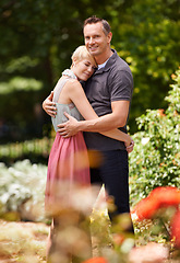 Image showing Hug, happy and couple in a park with love, trust and support, solidarity and security while bonding in nature. Commitment, care and people embrace on a field of flowers for spring romance or date