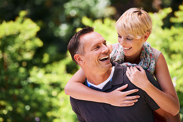 Image showing Love, piggyback and happy couple in a park for fun, romance and playful bonding in nature. Smile, hug and people in a garden with support, trust and security, laugh and back ride embrace outdoor