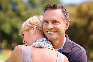 Image showing Love, couple and hug in nature with support, commitment and trust, care and solidarity while bonding in a park. Safety, security and people embrace in a garden with peace, calm or soulmate connection