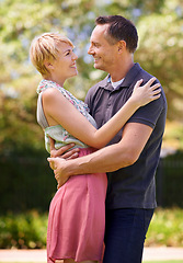 Image showing Couple, love and hug with happiness in outdoor for affection, romance and date in Australia. Closeup, relationship and together with smile for bonding, care and trust with commitment for support