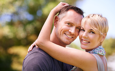 Image showing Hug, smile or portrait of couple in nature with love, trust and support, security or solidarity outdoor. Happy, face and people embrace in a park for bonding, care or romantic date in London together