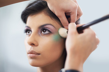 Image showing Face, hands and woman with brush for makeup and beauty, color powder and glamour with beautician on white background. Eyeshadow, cosmetology and cosmetic care with people in studio for styling