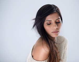 Image showing Woman, fashion and hair, makeup in studio for winter style and eyes closed, salon treatment and wellness on white background. Cosmetics, trendy jersey or sweater with haircare, volume and growth