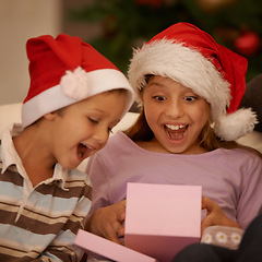 Image showing Wow, children and surprise with a Christmas gift for tradition, celebration or festive joy in their home. Siblings, box and kids in living room unboxing present for holiday, event or package in house