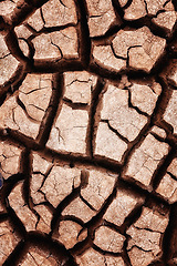 Image showing Arid climate, desert and top view of dry ground, nature and landscape with drought, environment and land in Africa. Texture, pattern and cracked Earth with natural background, soil and terrain