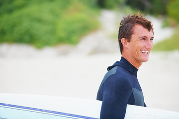 Image showing Man, surfer and face or smile on beach with surfboard for adventure, vacation or holiday. Surfing, person and happy with travel in nature for exercise, water sports or mockup in summer with wetsuit