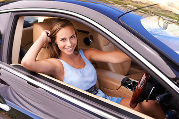 Image showing Portrait, travel and happy woman in sports car, driving or road trip with motor vehicle by window in Canada. Person, face and luxury automobile for journey, vacation and adventure in transportation