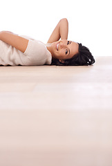 Image showing Woman, portrait and happiness on floor for relax with mock up space, weekend break and confidence in apartment. Person, lying down and face with smile in home on wooden flooring for fun and wellness