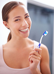 Image showing Portrait, smile and toothbrush for dental care with woman in bathroom of home for teeth whitening. Face, oral hygiene and happy young person in apartment to prevent tooth decay or gum disease