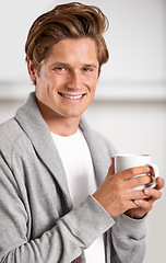 Image showing Smile, portrait and man with cup of coffee in kitchen of home for relax, health and wellness. Happy, confident and young male person drinking cappuccino, espresso or latte in modern apartment.