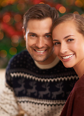 Image showing Portrait, Christmas and couple with holiday, romance and party with celebration and home with lights. Face, apartment and man with woman or peace with holiday and festive season with marriage or Xmas