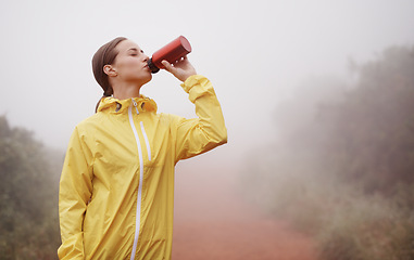 Image showing Nature, fitness and woman drinking water for running on dirt road with race or marathon training. Sports, workout and young female athlete enjoying beverage for hydration on outdoor cardio exercise.