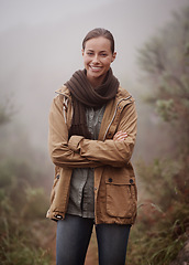 Image showing Hiking, portrait and happy woman with arms crossed in nature for travel, wellness or walk outdoor in winter. Face, pride hiker in a forest for fresh air, camping or adventure, journey or campsite fun