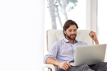 Image showing Businessman, relax and sofa with laptop online for remote work, living room and home office for freelance job. Male person, social media and browsing or research on computer, couch and smile