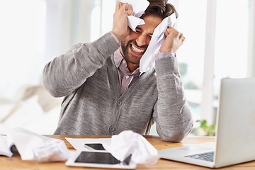 Image showing Man, laptop and frustrated at work with paper on desk, overtime and stress to meet deadline. Startup, office and documents for research on information for business growth with notes and upset