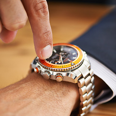 Image showing Hands, desk and wristwatch with pointing time for deadline at office, table and schedule for business. Closeup, check and appointment for work with commitment, punctual and plan for meeting.