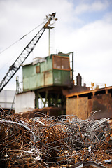 Image showing Crane, machine and junkyard for moving metal with sustainability, manufacturing or stop pollution. Vehicle, tractor and outdoor in scrapyard, plant or ecology for iron, steel industry and environment