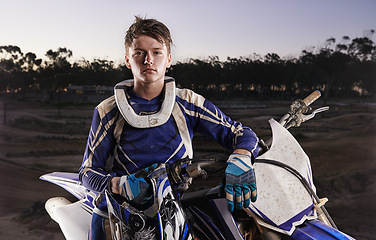 Image showing Sport, portrait and man with off road motorbike, confidence and gear for competition, race or challenge. Adventure, adrenaline and serious face of athlete on extreme course with dirt bike in evening