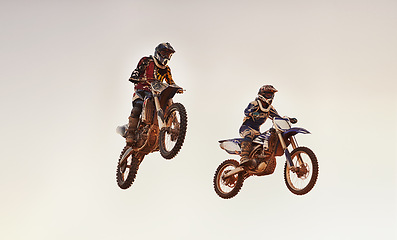 Image showing Jump, race and men on dirt bike with adventure, adrenaline and speed in stunt competition, Extreme sport, trick and athlete on off road motorcycle for challenge, power or danger on action course.