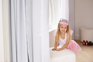 Image showing Princess, costume and portrait of girl in home for fun, playing and pretend for happy kids game. Fantasy, fashion and child in creative fairy fancy dress with wings, tiara and smile in bedroom.