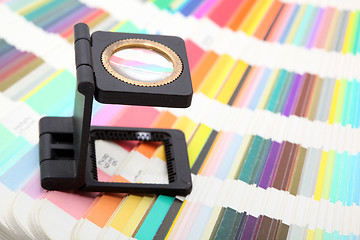 Image showing magnifying glass on colors