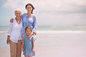 Image showing Portrait, smile and family generations on beach in summer together for travel, holiday or vacation. Senior mother, woman parent and girl child bonding on sand by sea or ocean for tropical getaway