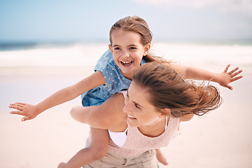 Image showing Mother, child and piggyback, airplane on the beach for bonding and love, travel and vacation in Mexico. Happiness, care and trust, woman and daughter playing game with flying and family time outdoor