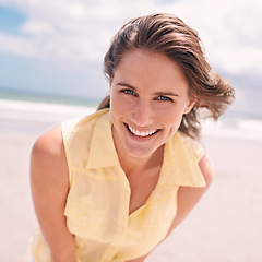 Image showing Happy woman, portrait and beach for summer holiday, weekend or tropical vacation in nature. Face of young female person with smile and yellow dress for fun travel or enjoying outdoor day by the ocean