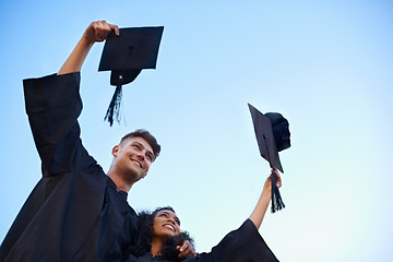 Image showing Graduation, university and students with blue sky for learning, studying and knowledge on academy campus. Education, friends and man and woman with hat for celebration, graduate ceremony and college