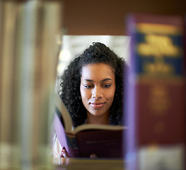 Image showing Reading, bookshelf and woman with books in library for knowledge, learning and studying at college. University, education and person with textbook for literature, research and information at academy