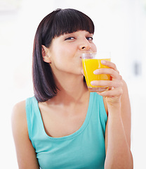 Image showing Portrait, orange juice and woman with drink for healthy diet, nutrition and wellness in home. Face, glass and person with beverage, vitamin c and organic fruit liquid for breakfast in the morning