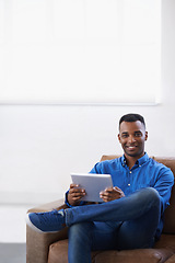 Image showing Man, tablet and online in portrait at home, subscribe and internet for website or blog. Black male person, smile and streaming entertainment on couch, mockup space and app for shopping on weekend