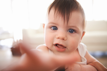 Image showing Happy, cute and closeup portrait of baby with child development or growth in living room at home. Smile, excited and face of sweet toddler, infant or kid reaching hand in lounge at modern house.