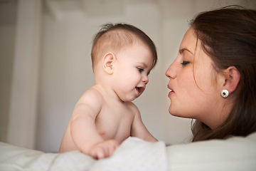 Image showing Mother, baby and love connection in home with parenting bonding on bed for childhood development, support or safety. Kid, female person and together for young nurture or nursery, relax or security