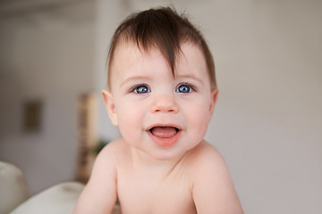 Image showing Happy, cute and portrait of baby in nursery playing for child development in living room at home. Sweet, adorable and young infant, toddler or kid learning sitting in bedroom in modern house.
