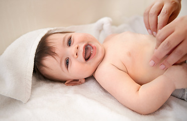 Image showing Portrait, baby and boy with diaper, smile and excited with blanket or relax with happiness. Face, infant or kid with humor or laughing with wellness or healthy with nappy or joyful with child or home