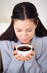 Image showing Aroma, coffee and woman with drink in home, calm or relax for breakfast in the morning. Smell, latte and person with espresso in cup, beverage and fresh cappuccino with eyes closed for peace in house