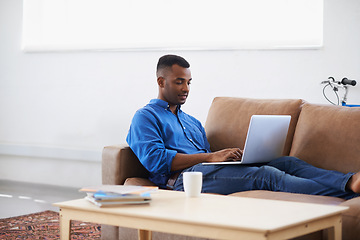 Image showing Man, laptop and internet for remote work at home, freelancer and copywriting in living room. Black male person, online and plan on tech or connection for website, information and research for article