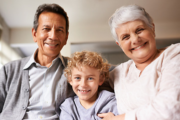 Image showing Portrait, grandparents and boy with happiness, love and bonding together with joy or apartment. Family, face or old man with elderly woman, kid or grandchild with hug or cheerful with home or embrace