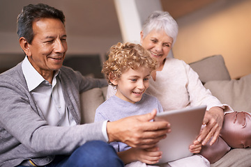 Image showing Happy family, grandparents and little boy with tablet for entertainment, social media or research on sofa at home. Grandma, grandpa and child smile on technology for online search or movie at house