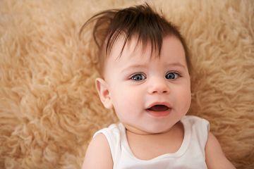 Image showing Portrait, home and baby on carpet, relax and happy on floor of nursery in morning. Child development, growth and face of cute toddler in house with comfort, above and adorable infant waking up