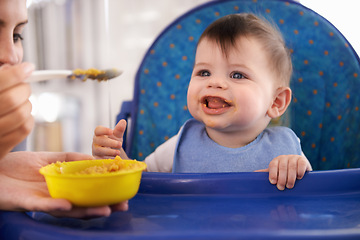 Image showing Baby, parent and spoon for feeding food in chair for morning nutrition in apartment for breakfast, development or lunch. Kid, childcare and fingers for toddler dinner or wellness, hungry or vitamins