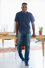 Image showing Black man, intern and portrait in office for creative career, working or excited for new job. South African male, copywriter or documents on desk at workplace for development, growth or opportunity