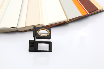 Image showing paper samples and lense