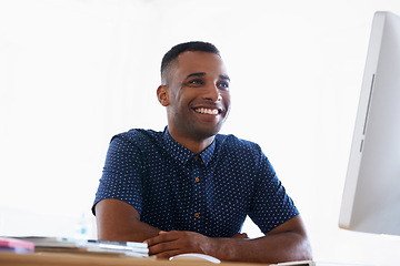 Image showing Computer, smile and man with research in office for creative project on internet by desk. Technology, happy and professional male designer working online with desktop for career in modern workplace.