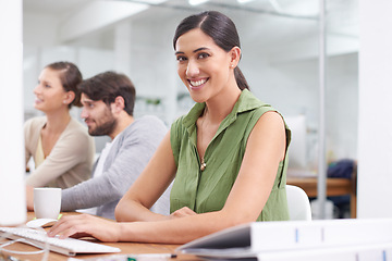 Image showing Creative, coworking space and portrait of woman in office with keyboard, typing and admin at small business. Computer, desk and happy consultant, planner or professional writing email communication