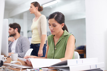 Image showing Administration, coworking space and woman at desk with document, reading and small business. Computer, office and female consultant checking paperwork, for research, review or professional contract